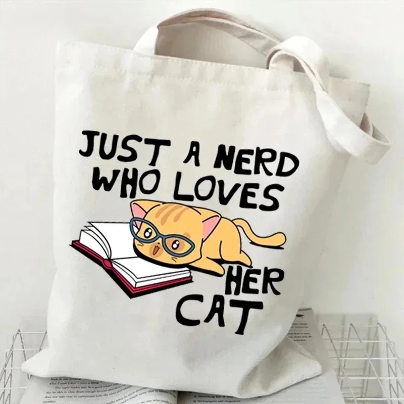 القط والكتاب حقيبة يد قماش الس - مراجعة Tote Bag Canvas Print وسعره